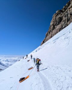Dragging sleds sideways across the transverse slopes through Windy Corner.